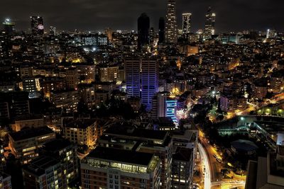 Aerial view of city lit up at night