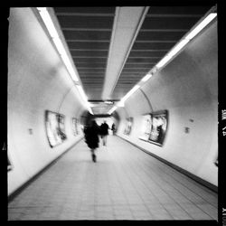 People walking in subway tunnel