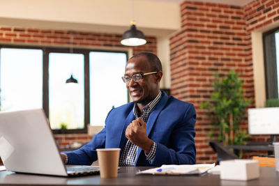 Happy businessman at office