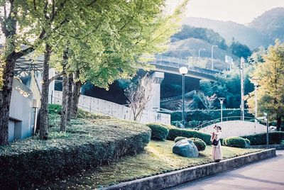 Footpath by buildings in city