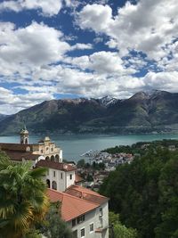 Townscape by sea against sky