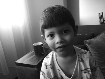 Close-up portrait of boy at home