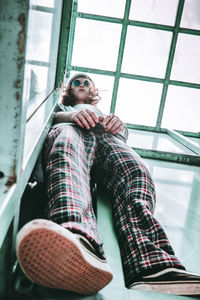 Low angle view of teenage girl wearing sunglasses