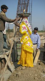 Full length of woman standing on ground