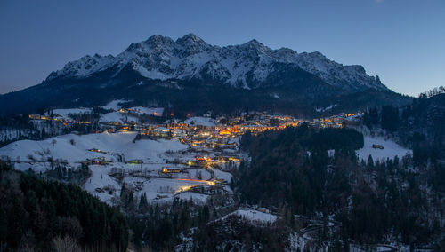 Scenic view of snow covered mountains against sky