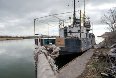 Boats moored at harbor