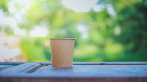 Close-up of coffee cup on table