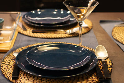 Close-up of wine glasses on table