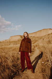 Portrait of man standing on field