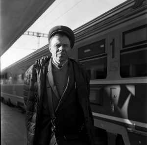 Portrait of man standing on train