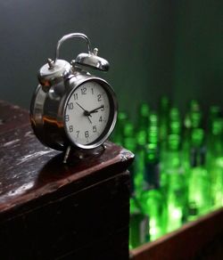 Close-up of clock on table