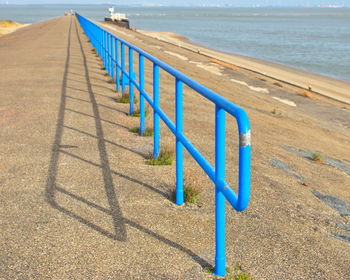 Row of railing on beach