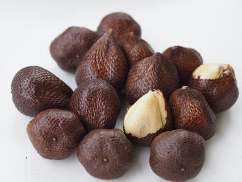 Close-up of fruits on white table