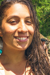 Close-up portrait of a smiling young woman