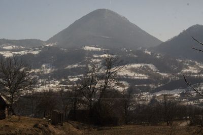 Scenic view of landscape and mountains against sky