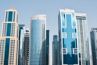 Low angle view of modern buildings against clear sky