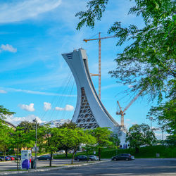 Low angle view of suspension bridge against sky