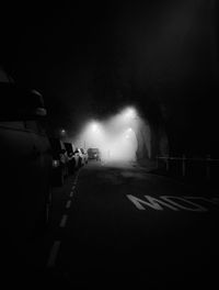 People on illuminated stage