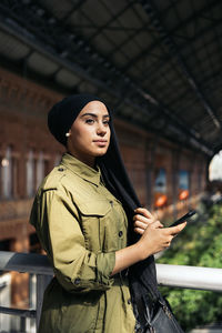 Young woman using mobile phone