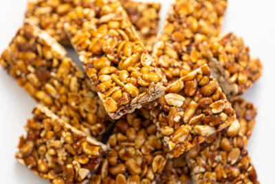 Close-up of roasted coffee beans against white background