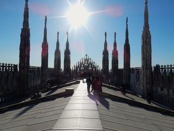 Panoramic view of buildings against sky on sunny day