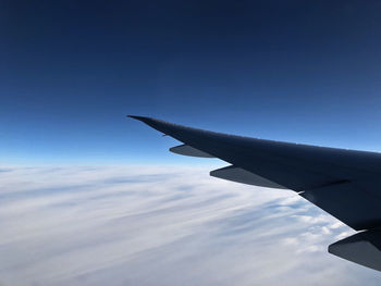 Low angle view of airplane flying in sky