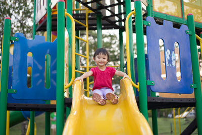 Portrait of happy girl playing in playground