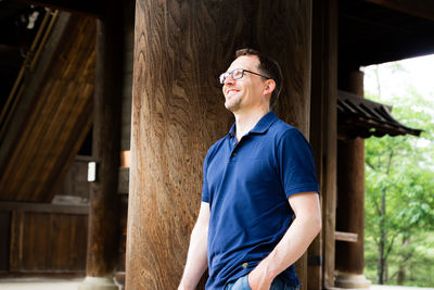 Young man wearing sunglasses standing outdoors