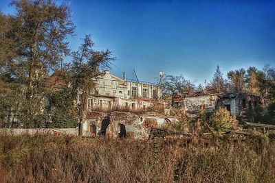 Buildings against clear blue sky