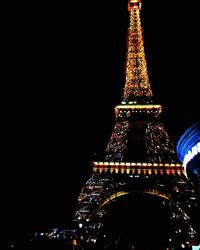 Low angle view of tower at night