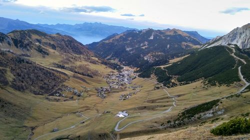 High angle view of road amidst mountains against sky