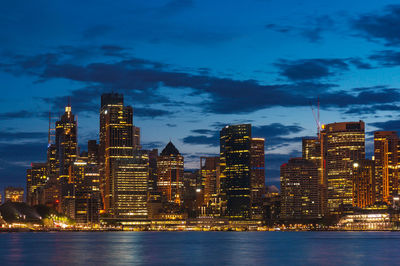 Sydney cityscape at dusk, blue hour with illuminated buildings of central business district, cbd