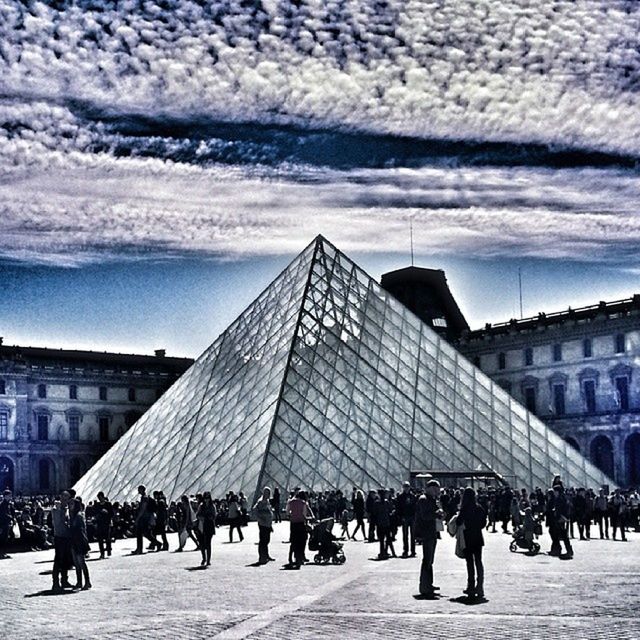 architecture, building exterior, built structure, sky, large group of people, cloud - sky, city, cloud, men, person, cloudy, city life, lifestyles, walking, leisure activity, modern, day, travel destinations, building