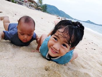 Portrait of cute baby girl on beach