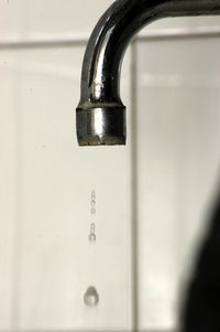 Close-up of faucet in bathroom