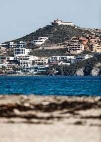 View of townscape by sea