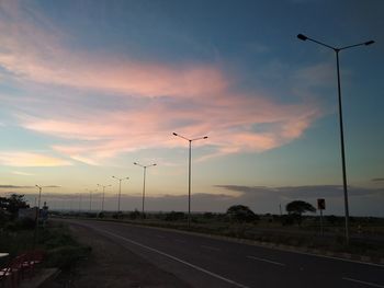 Street against sky during sunset