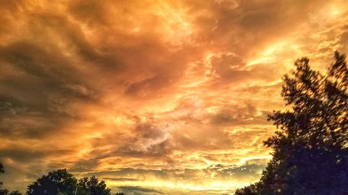 Low angle view of dramatic sky during sunset