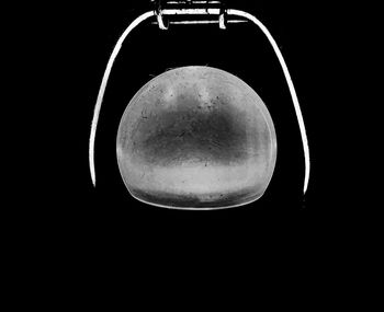 Close-up of electric lamp against black background