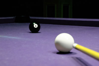 Cropped hand playing pool