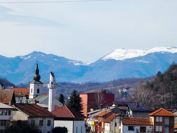 Houses against clear sky during winter