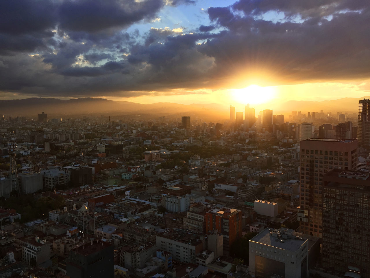 HIGH ANGLE VIEW OF CITYSCAPE AGAINST ROMANTIC SKY