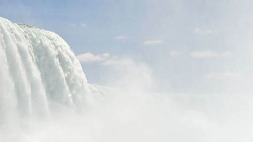 Low angle view of snow against sky