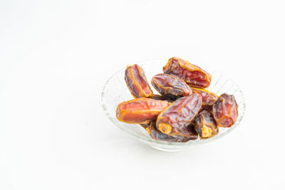High angle view of food in plate against white background