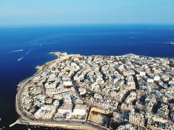 High angle view of sea amidst buildings in city