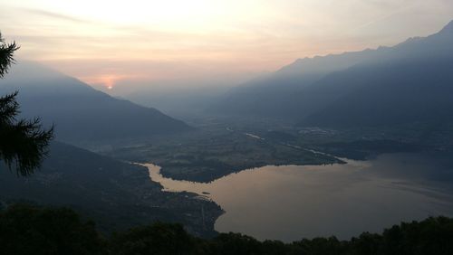 Scenic view of mountains against sky at sunset