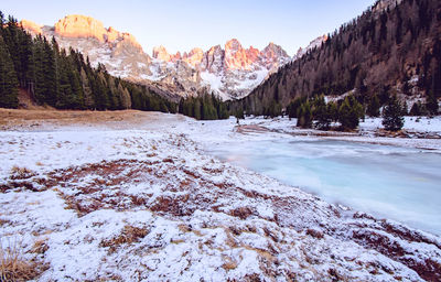 Scenic view of landscape against sky during winter