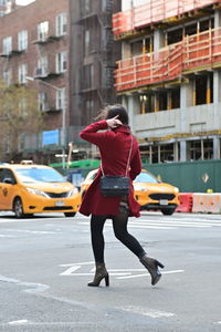 Low angle view of man walking on building