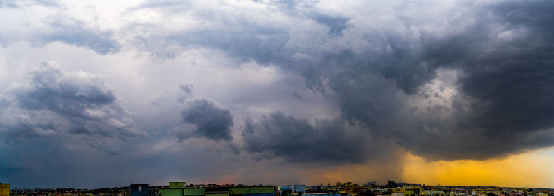 Panoramic view of storm clouds over city