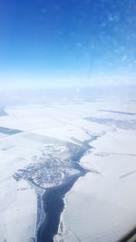 Aerial view of snow covered landscape